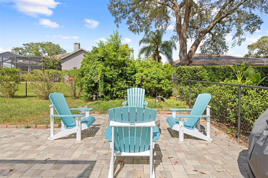 14173 Pullman Drive Spring Hill, FL 34609 - Photo 73 of 77 a view of a chair and tables in the backyard
