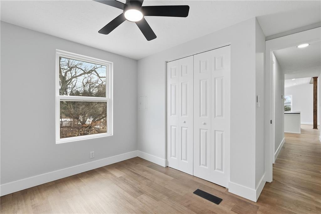 105 York Road Cranberry Township, PA 16066 - Photo 11 of 18 a view of an empty room with wooden floor and window