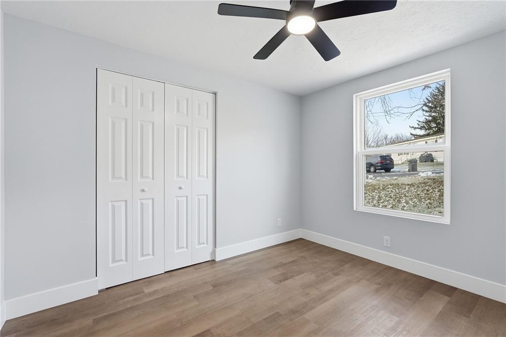 105 York Road Cranberry Township, PA 16066 - Photo 12 of 18 an empty room with wooden floor and windows