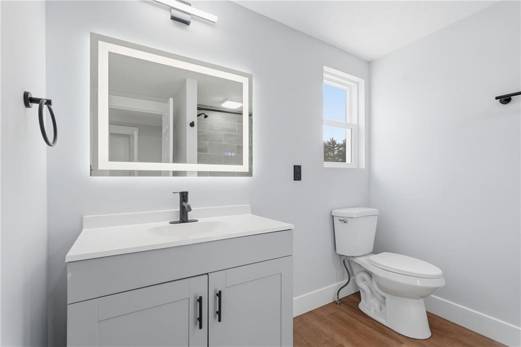 105 York Road Cranberry Township, PA 16066 - Photo 13 of 18 a bathroom with a toilet a sink and mirror
