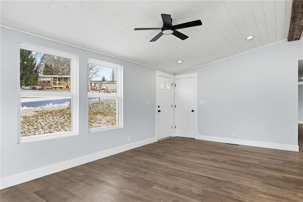 105 York Road Cranberry Township, PA 16066 - Photo 3 of 18 a view of an empty room with wooden floor and a window