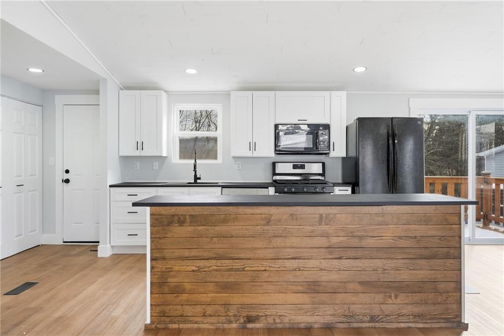 105 York Road Cranberry Township, PA 16066 - Photo 6 of 18 a large kitchen with stainless steel appliances granite countertop a stove a sink and a refrigerator