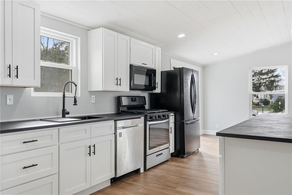 105 York Road Cranberry Township, PA 16066 - Photo 7 of 18 a kitchen with stainless steel appliances granite countertop a refrigerator sink and stove