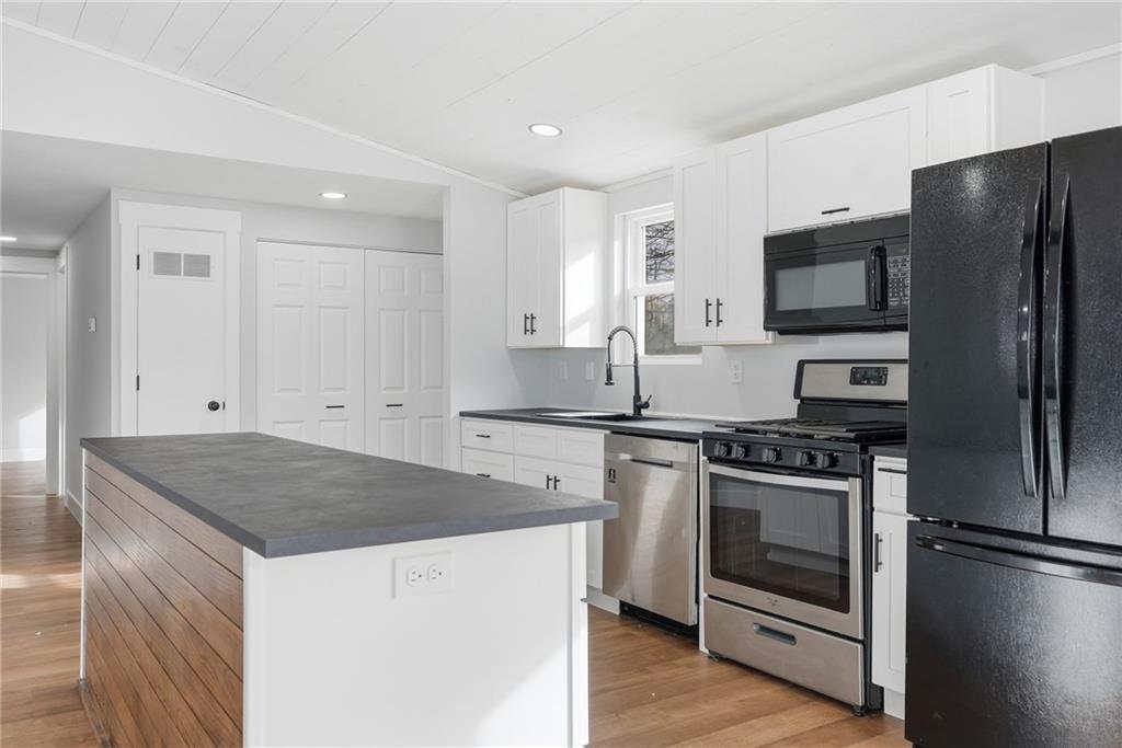 105 York Road Cranberry Township, PA 16066 - Photo 8 of 18 a kitchen with a stove a refrigerator and a sink