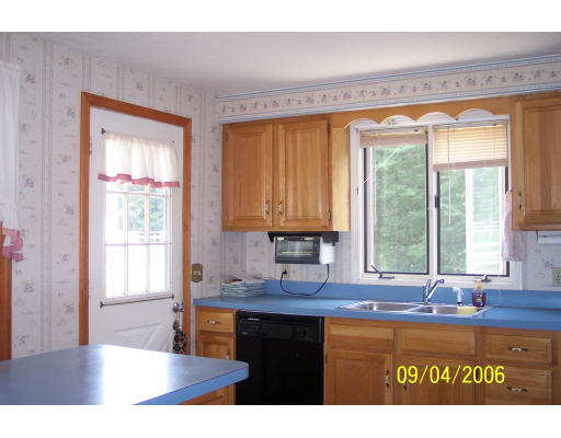 188 New Boston Road Sturbridge, MA 01566 - Photo 4 of 13 a kitchen with a window a sink and a counter top space