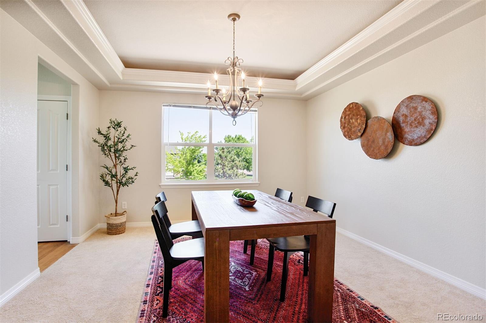 16283 Olive Way Brighton, CO 80602 - Photo 16 of 33 a dining room with a table and chairs