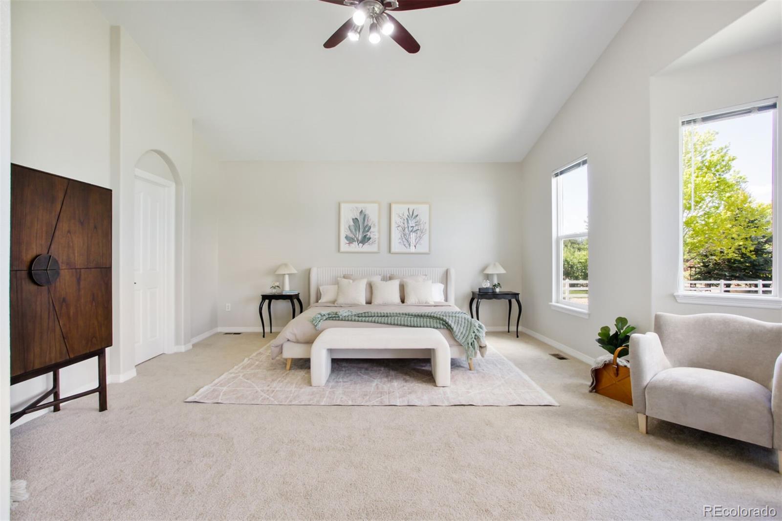 16283 Olive Way Brighton, CO 80602 - Photo 18 of 33 a living room with furniture and a large window