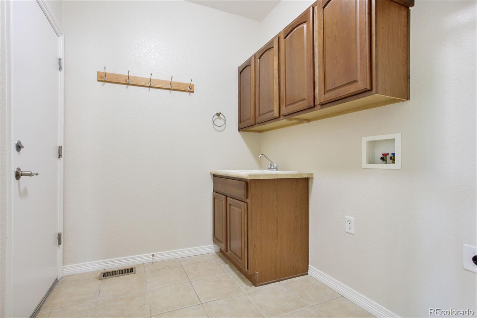 16283 Olive Way Brighton, CO 80602 - Photo 28 of 33 a view of cabinets