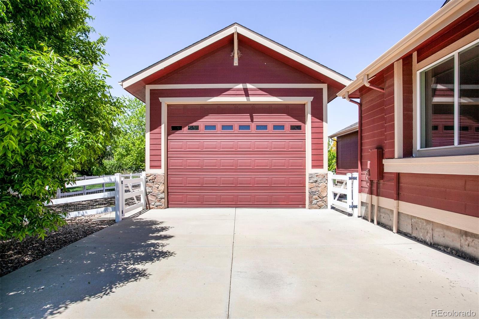 16283 Olive Way Brighton, CO 80602 - Photo 31 of 33 a front view of a house with a garage