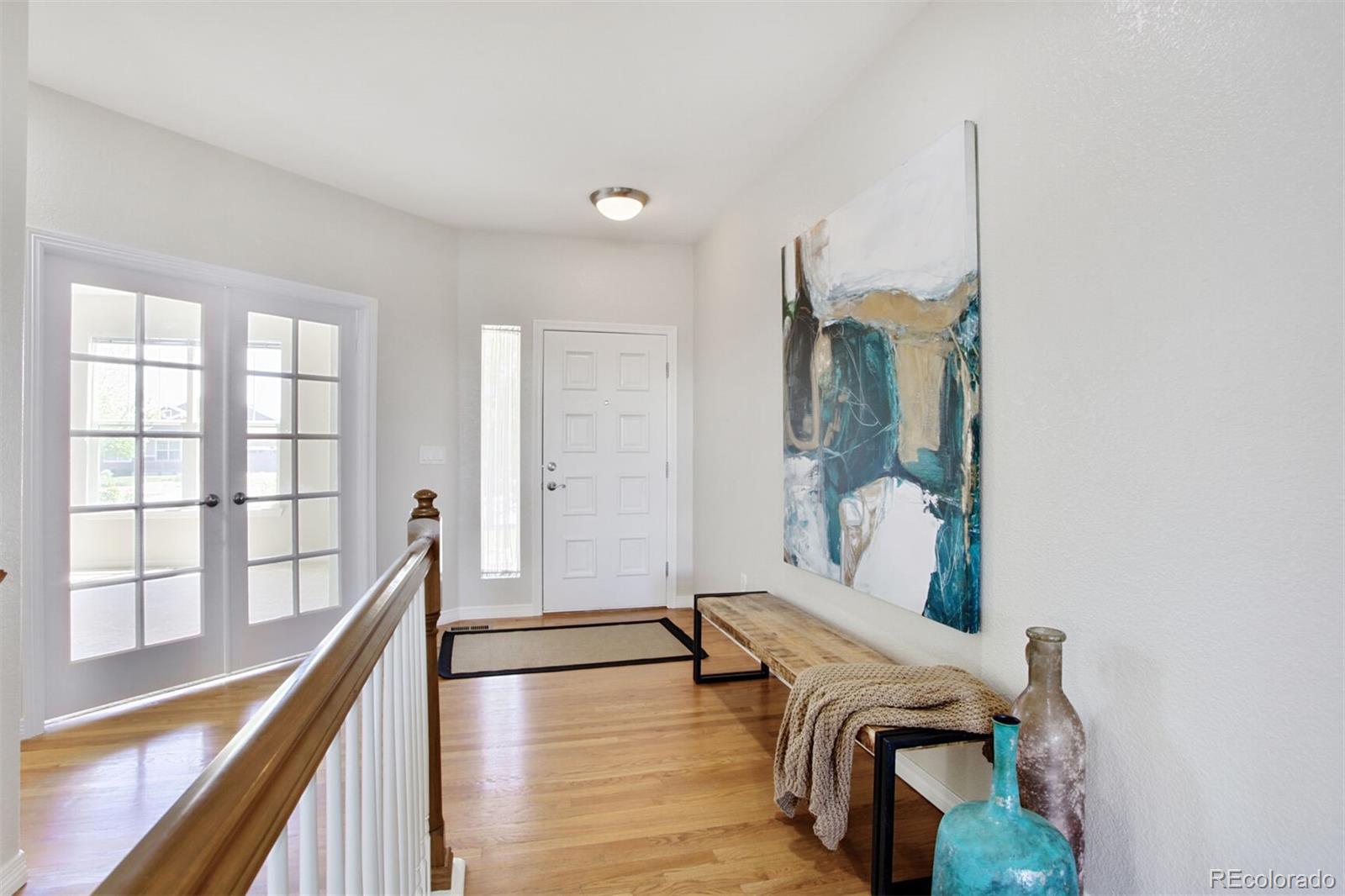 16283 Olive Way Brighton, CO 80602 - Photo 6 of 33 a living room with furniture and a large window