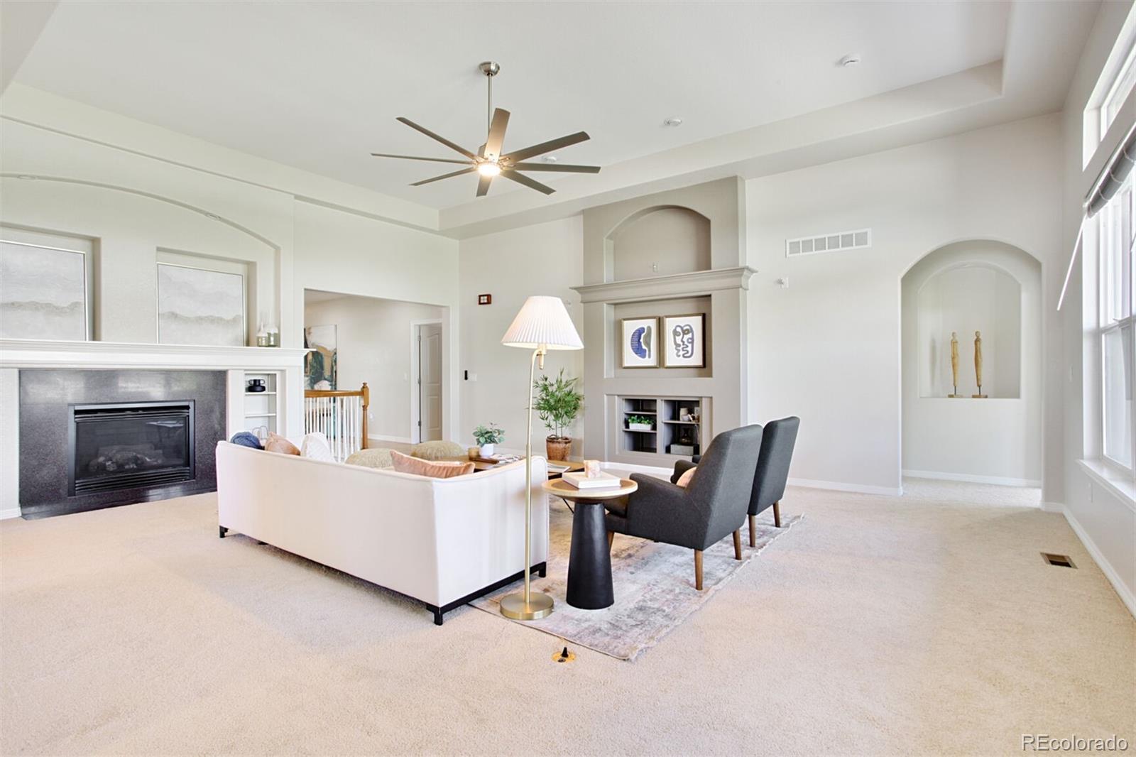 16283 Olive Way Brighton, CO 80602 - Photo 7 of 33 a living room with furniture and a fireplace