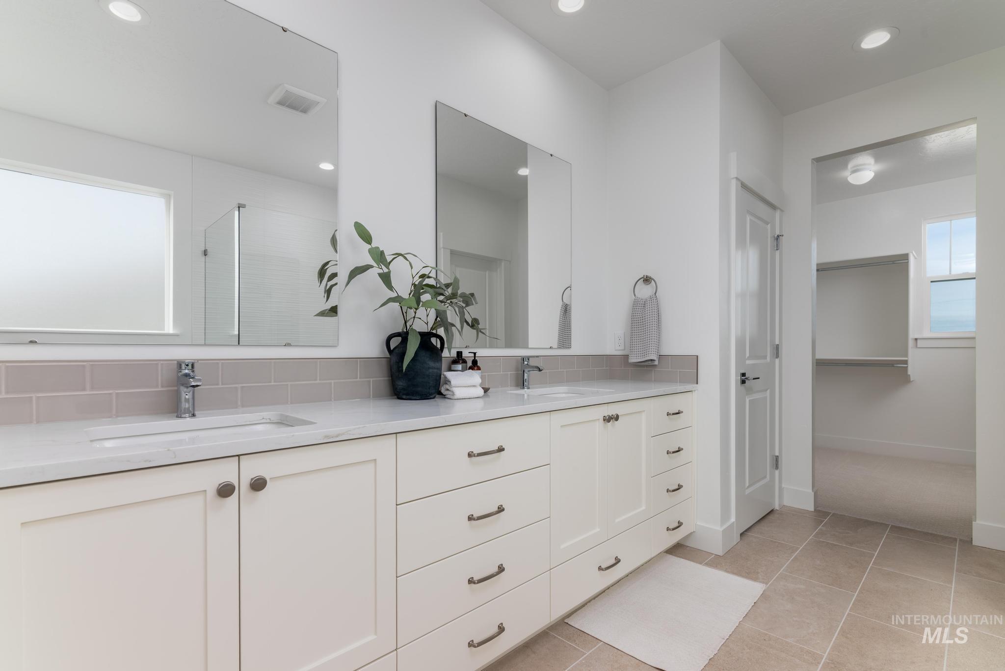 2005 North Spg Crk Avenue Middleton, ID 83644 - Photo 23 of 45 Bathroom featuring plenty of natural light, a shower stall, double vanity, tasteful backsplash, and recessed lighting
