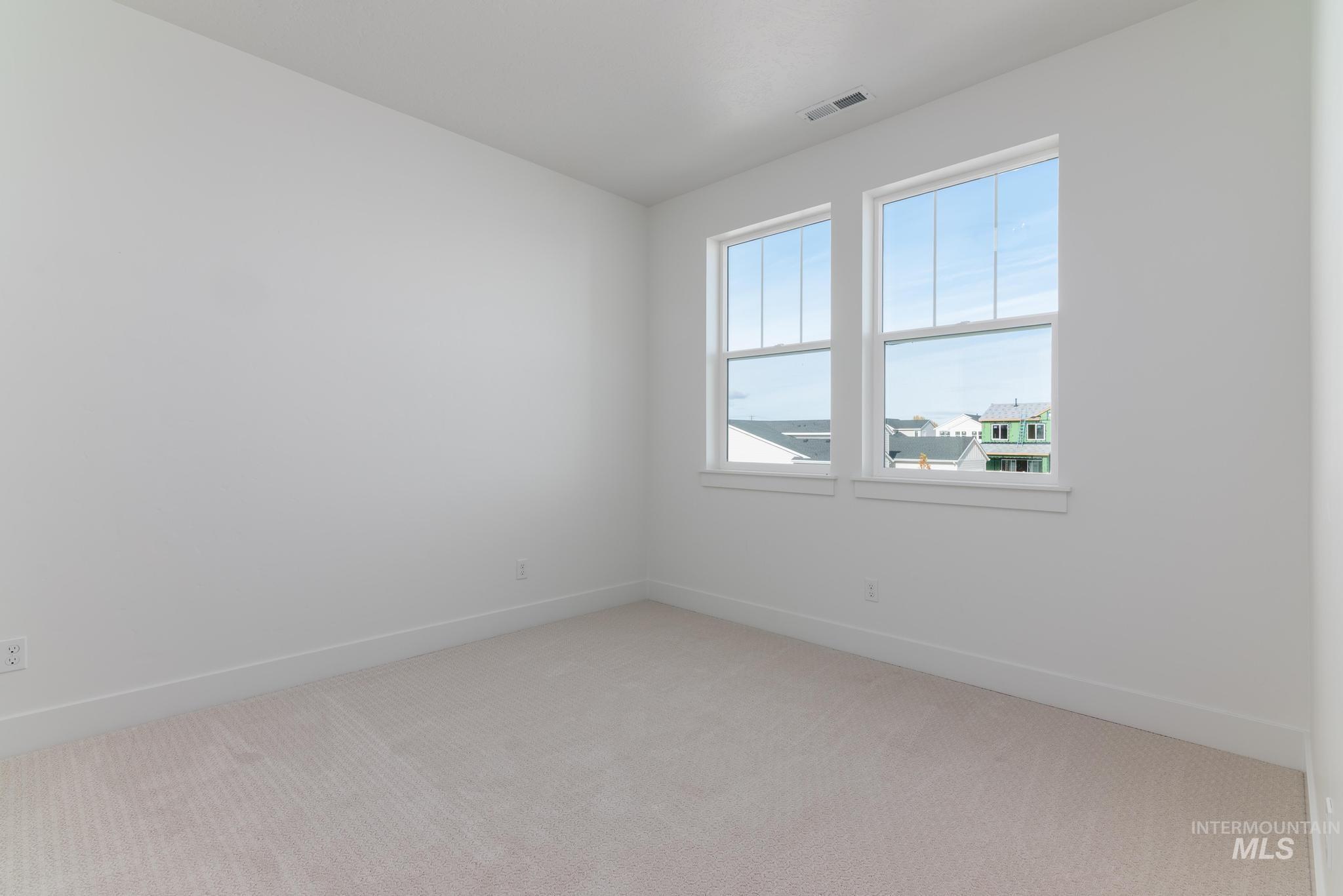 2005 North Spg Crk Avenue Middleton, ID 83644 - Photo 26 of 45 Empty room featuring light colored carpet and baseboards