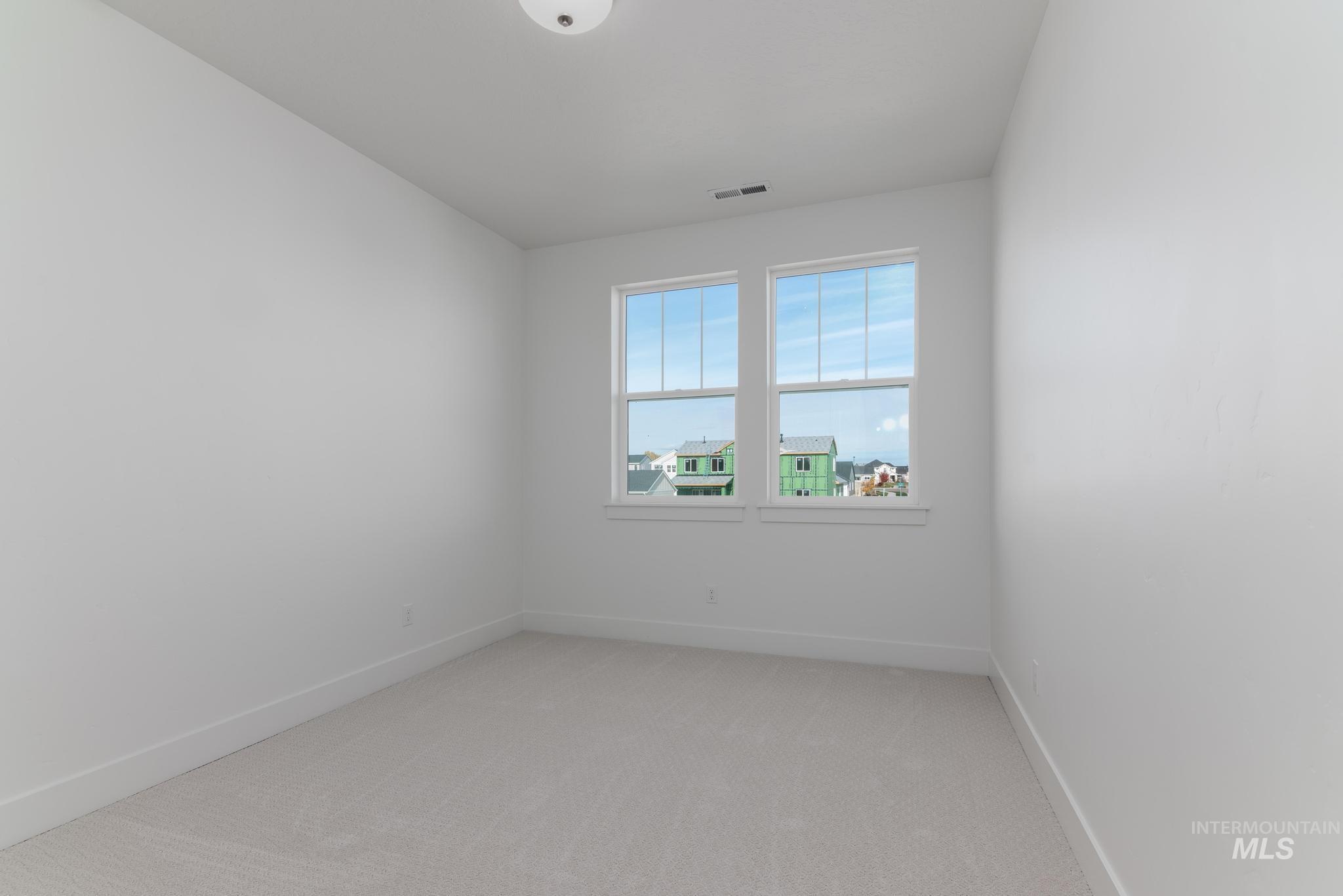 2005 North Spg Crk Avenue Middleton, ID 83644 - Photo 30 of 45 Spare room with light carpet and baseboards