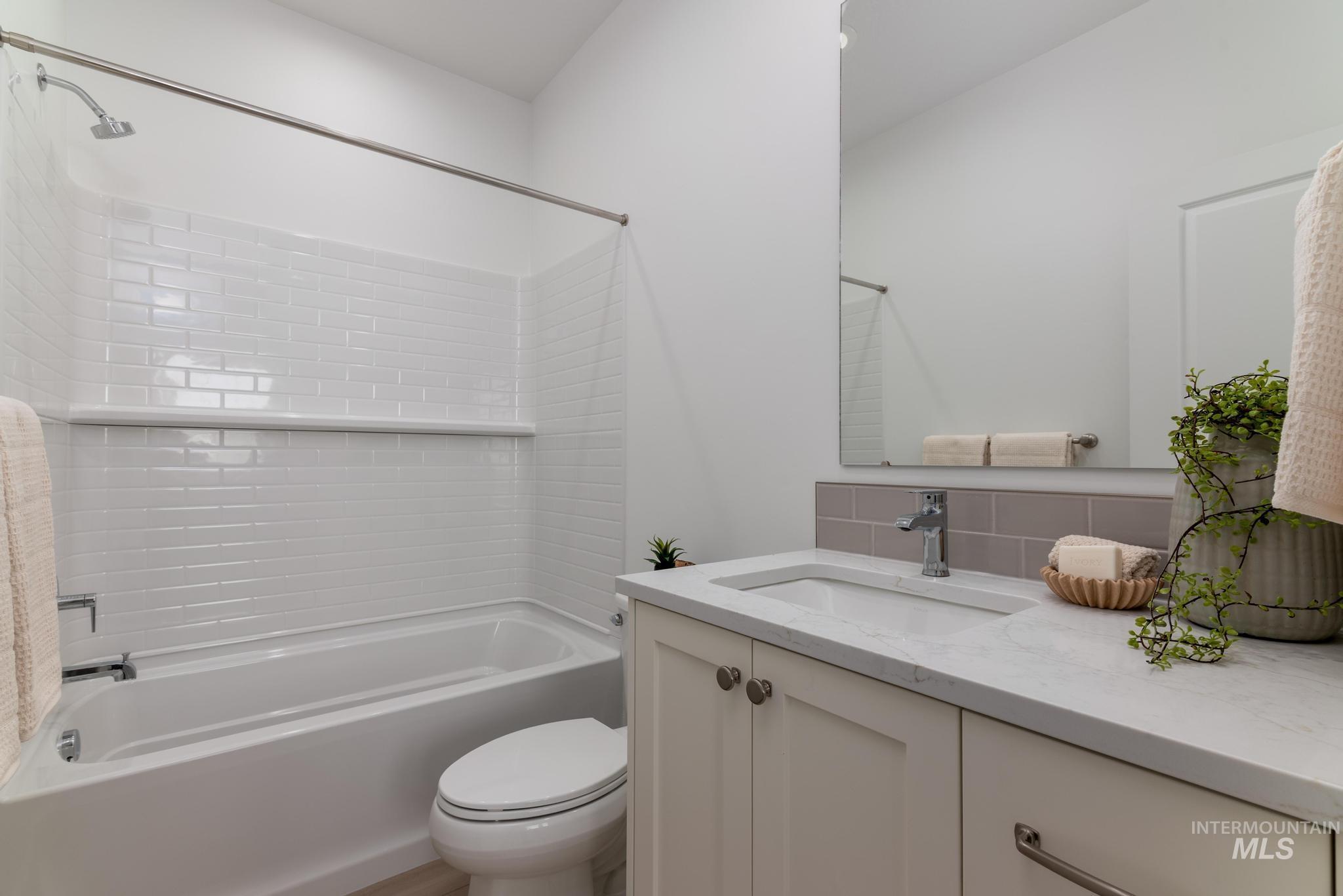 2005 North Spg Crk Avenue Middleton, ID 83644 - Photo 31 of 45 Bathroom with vanity, shower / tub combination, and decorative backsplash