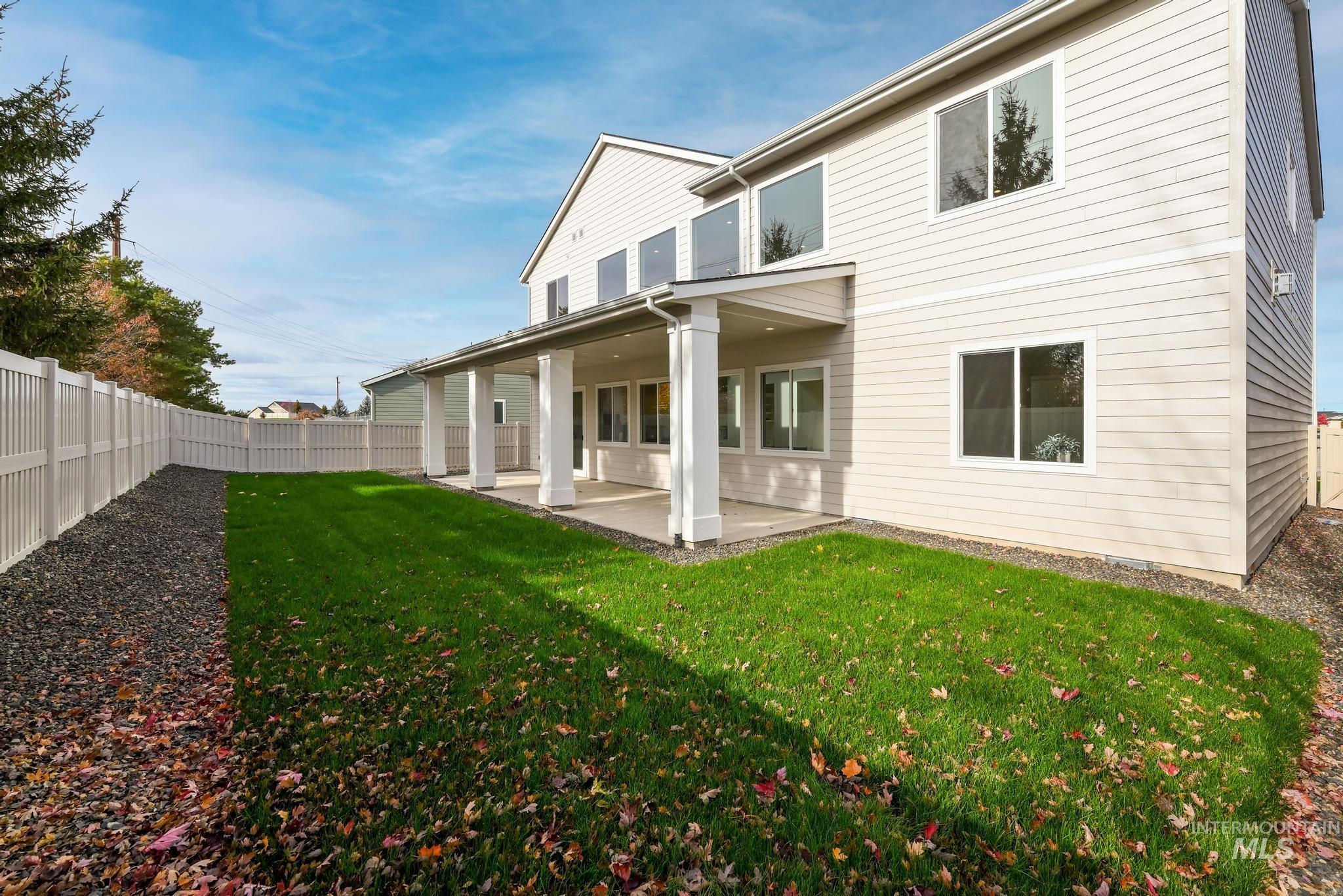 2005 North Spg Crk Avenue Middleton, ID 83644 - Photo 32 of 45 Rear view of house featuring a patio area and a fenced backyard
