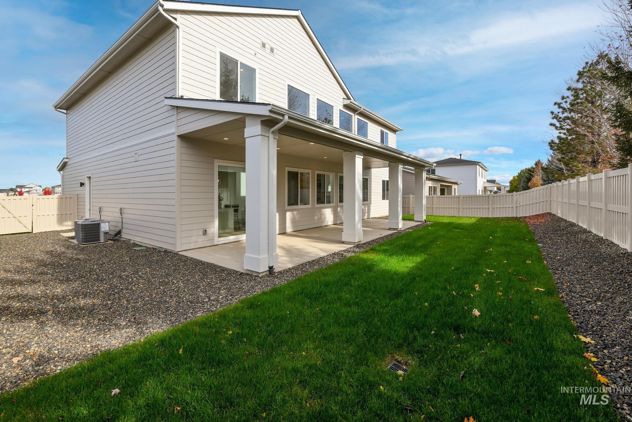 2005 North Spg Crk Avenue Middleton, ID 83644 - Photo 33 of 45 Rear view of property featuring a fenced backyard and a patio
