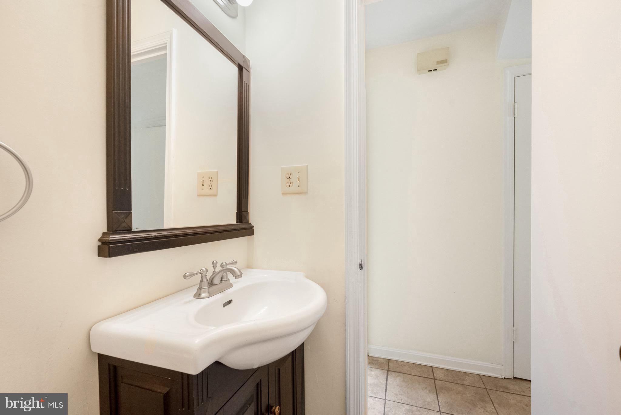 7223 Reservation Drive Springfield, VA 22153 - Photo 32 of 40 Charming bathroom with modern elegance.
