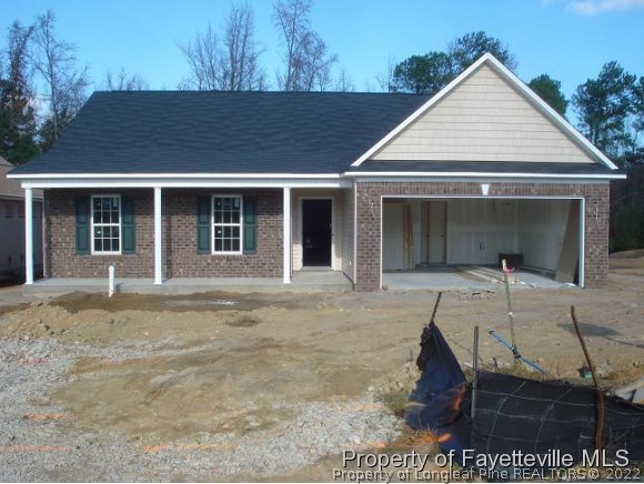 5636 Nessee Street Fayetteville, NC 28314 - Photo 1 of 4 front view of a house with a yard
