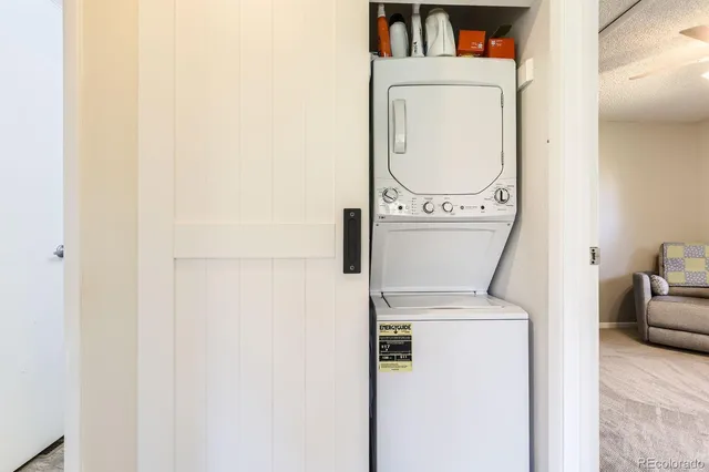 a view of a storage room with furniture and a window