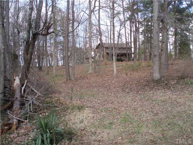 7700 Secluded Acres Road Apex, NC 27523 - Photo 1 of 6 NICE PICTURESQUE SETTING FOR LOG HOME BACK FROM THE ROAD IN MIDDLE OF LOT OVERLOOKING POND.