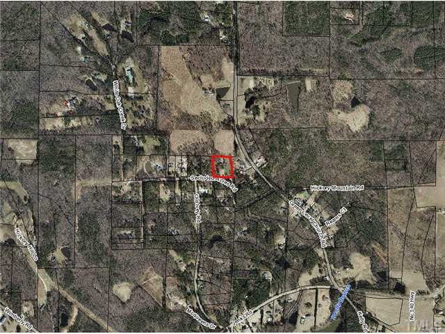 7700 Secluded Acres Road Apex, NC 27523 - Photo 4 of 6 AERIAL ZOOMED OUT TO SHOW THE SURROUNDING HIGHLY DESIREABLE GREEN LEVEL COMMUNITY.THIS PROPERTY IS JUST MINUTES FROM NC 55, US 64 , NC 751 AND i-540 coming in 2012.