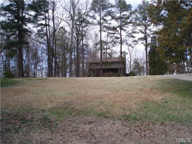 7700 Secluded Acres Road Apex, NC 27523 - Photo 5 of 6 Another view of cabin home from Secluded Acres Road.
