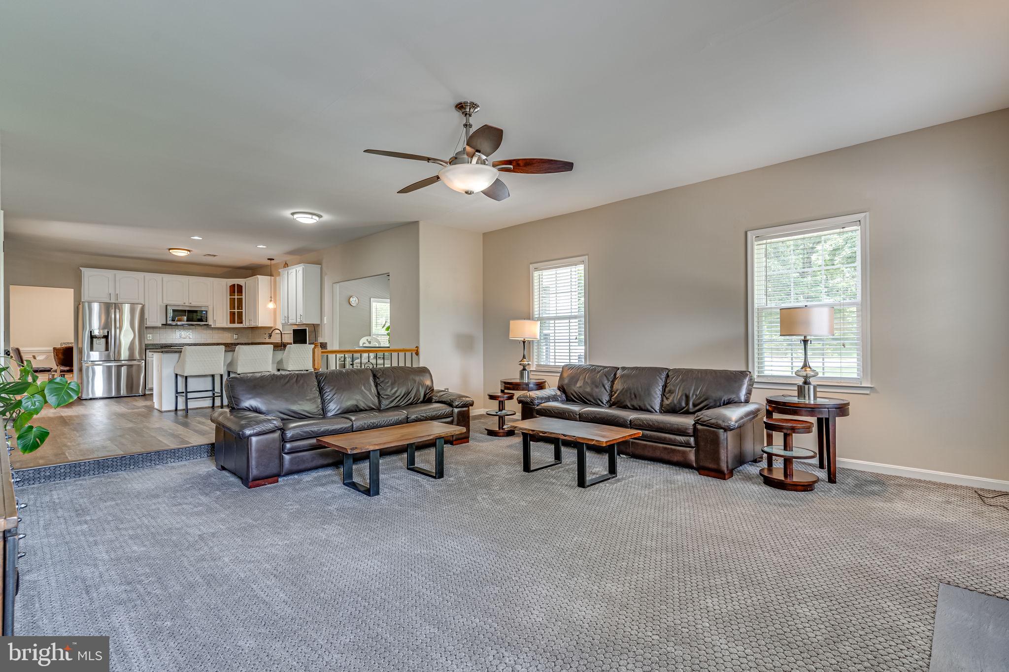 6904 North Stuart Road King George, VA 22485 - Photo 14 of 47 a living room with furniture and a ceiling fan