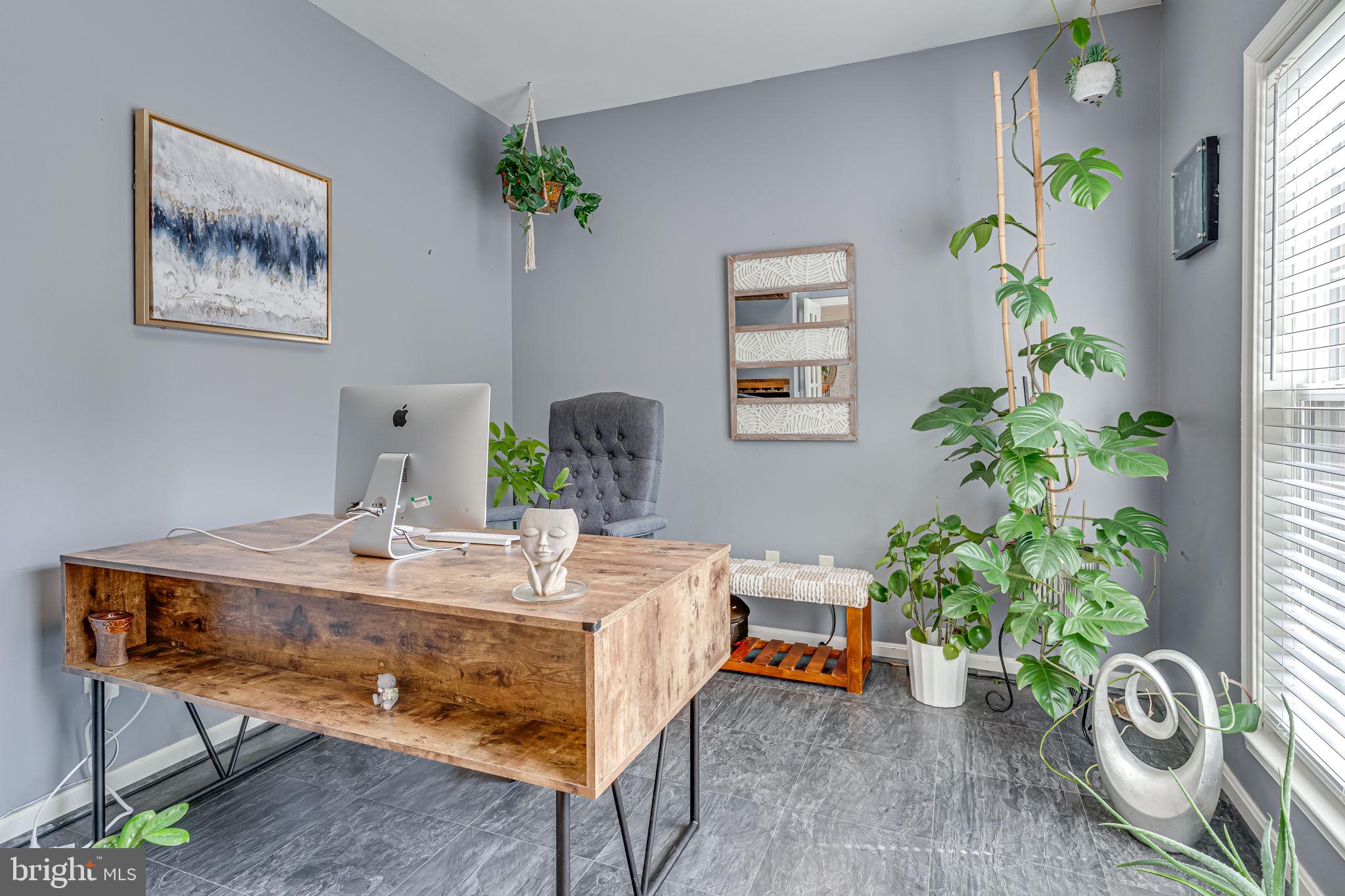 6904 North Stuart Road King George, VA 22485 - Photo 18 of 47 a workspace with furniture and a potted plant