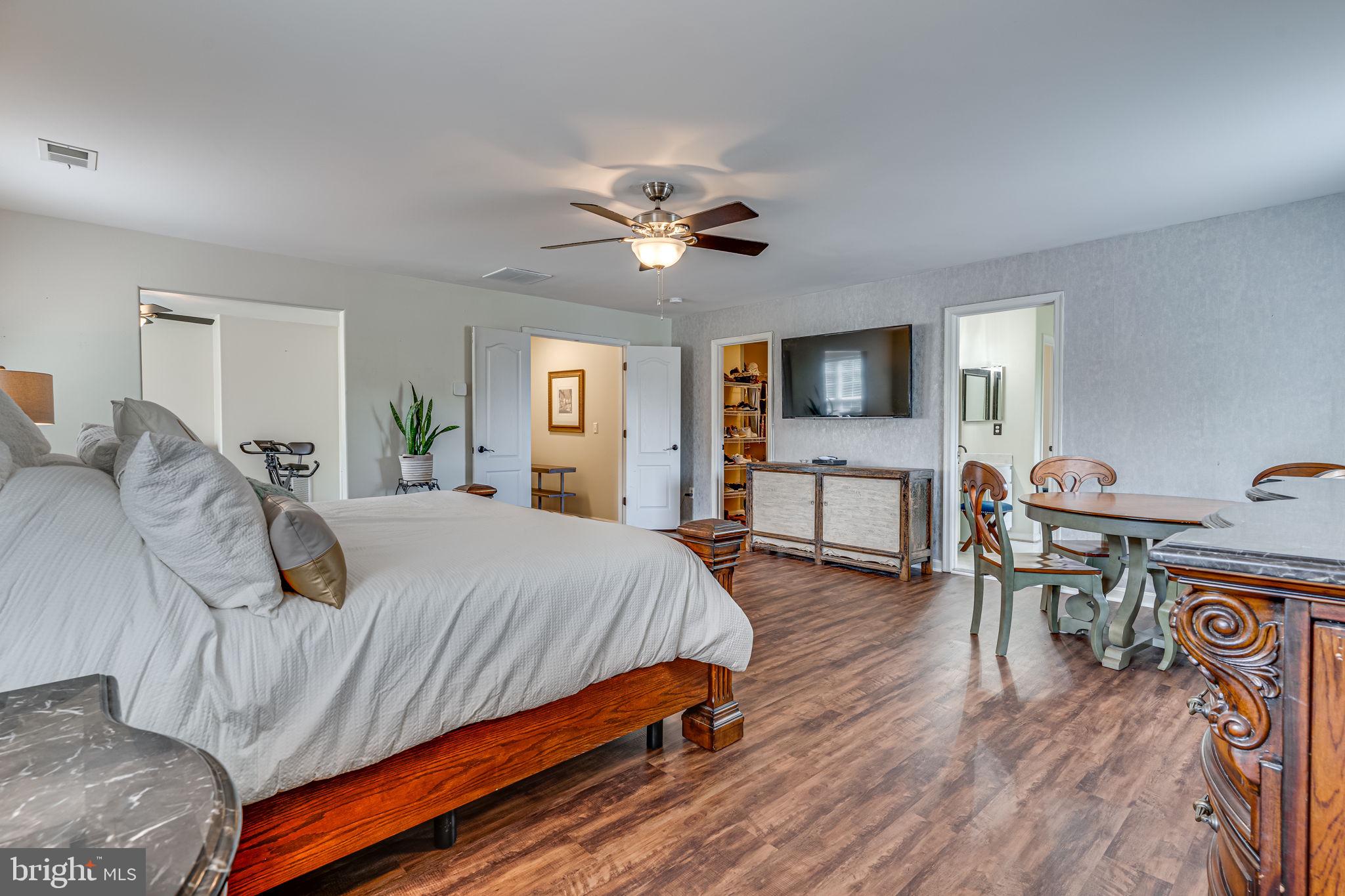 6904 North Stuart Road King George, VA 22485 - Photo 26 of 47 a bedroom with a bed and wooden floor