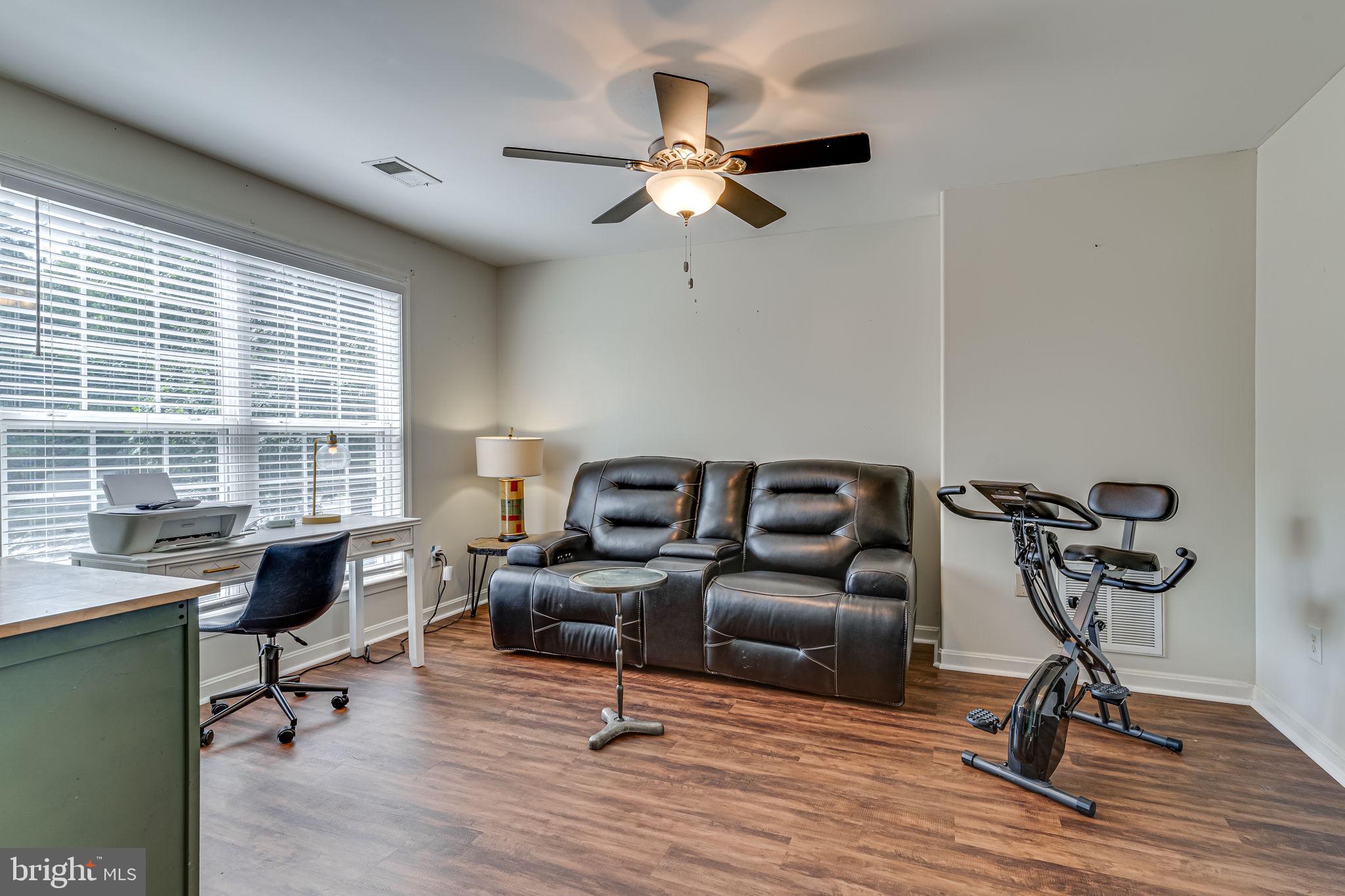 6904 North Stuart Road King George, VA 22485 - Photo 27 of 47 a living room with furniture and a window