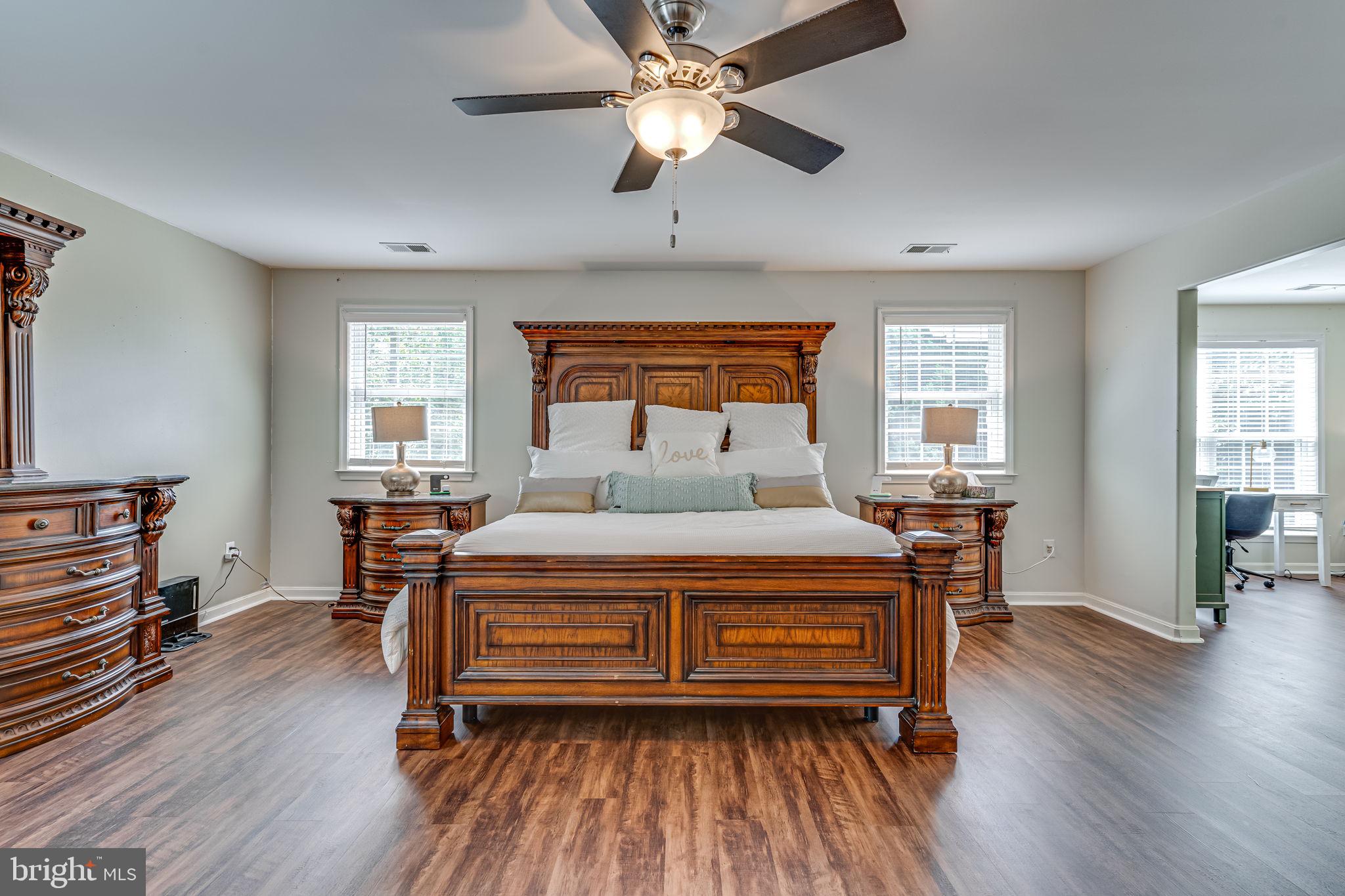6904 North Stuart Road King George, VA 22485 - Photo 28 of 47 a bedroom with a bed and wooden floor