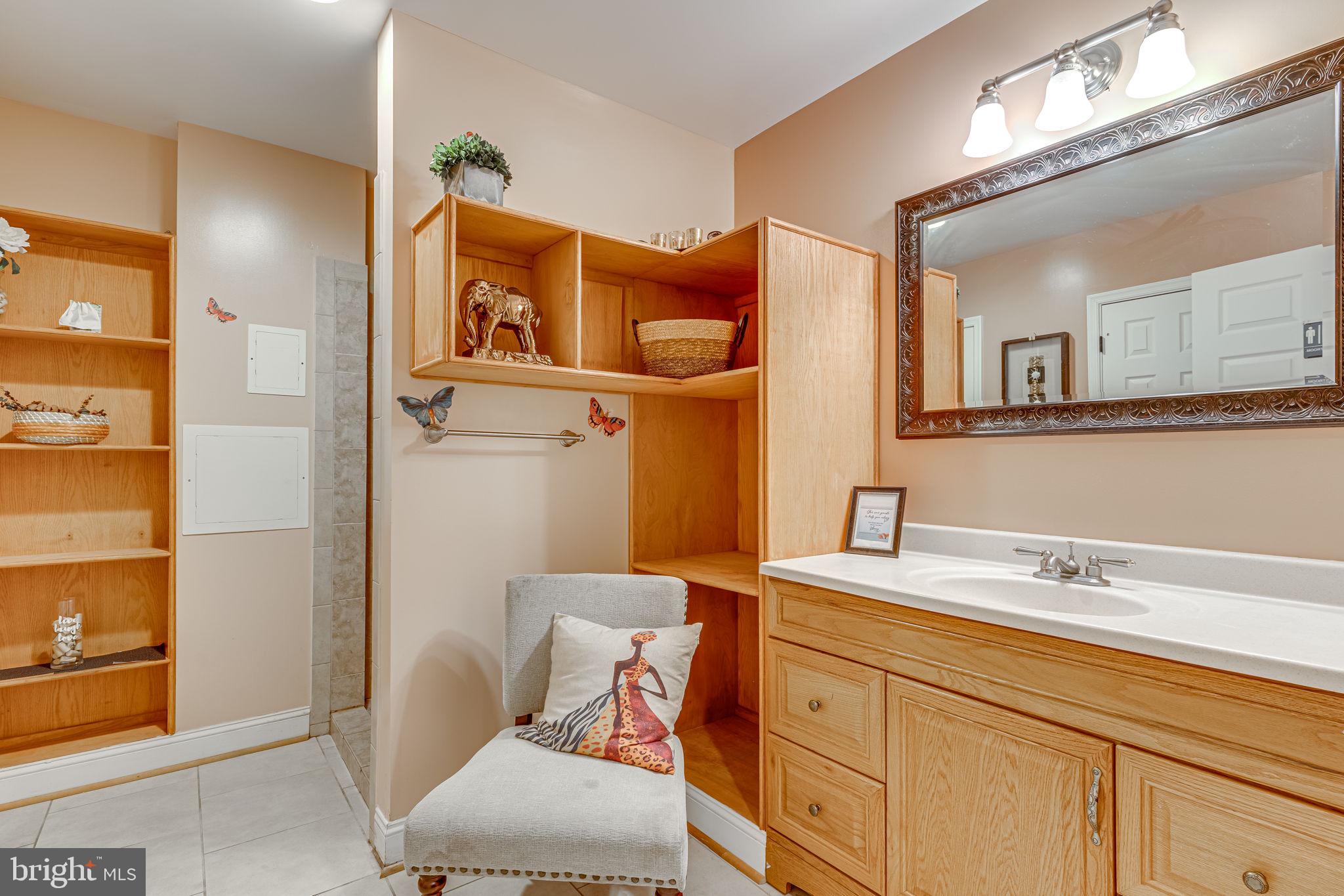 6904 North Stuart Road King George, VA 22485 - Photo 30 of 47 a bathroom with a sink and a mirror