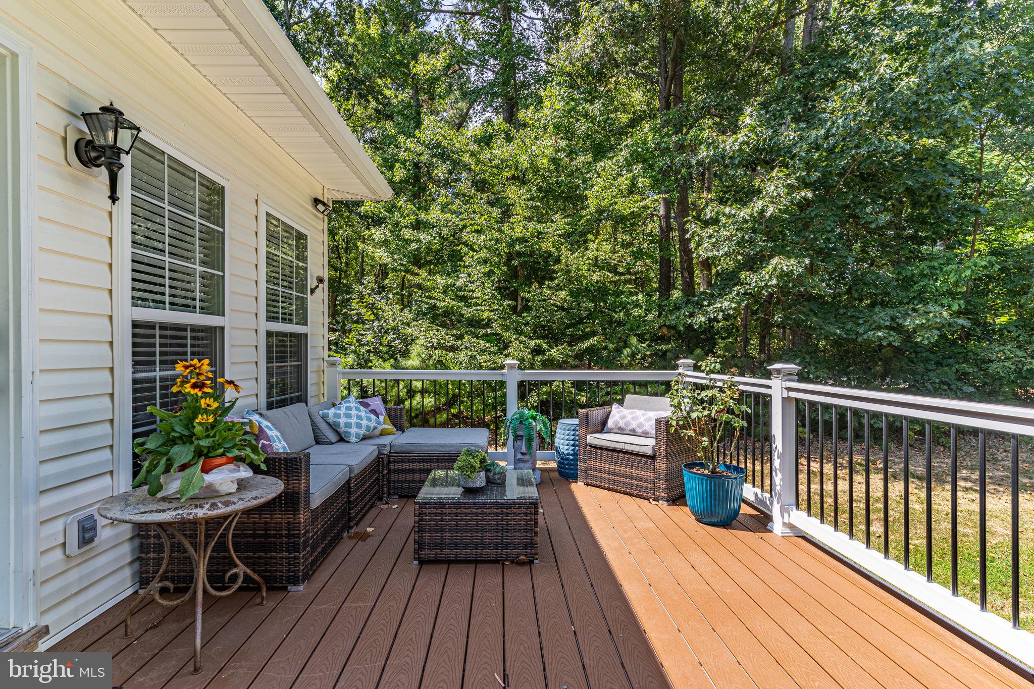 6904 North Stuart Road King George, VA 22485 - Photo 35 of 47 a balcony with wooden floor and outdoor seating