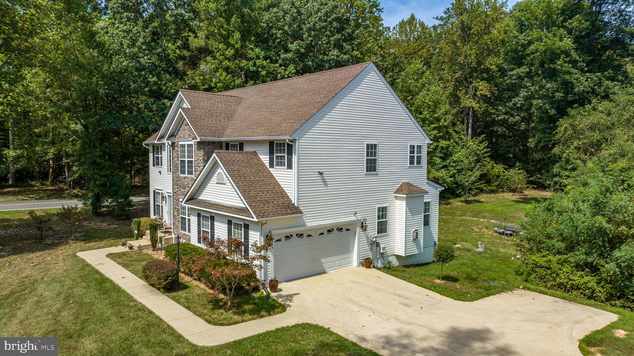 6904 North Stuart Road King George, VA 22485 - Photo 37 of 47 a front view of house with yard and green space