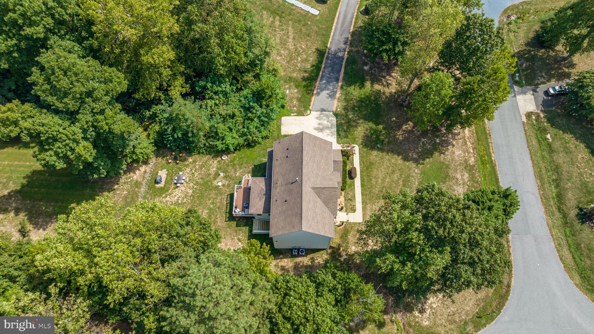 6904 North Stuart Road King George, VA 22485 - Photo 44 of 47 an aerial view of a house with a yard and large trees
