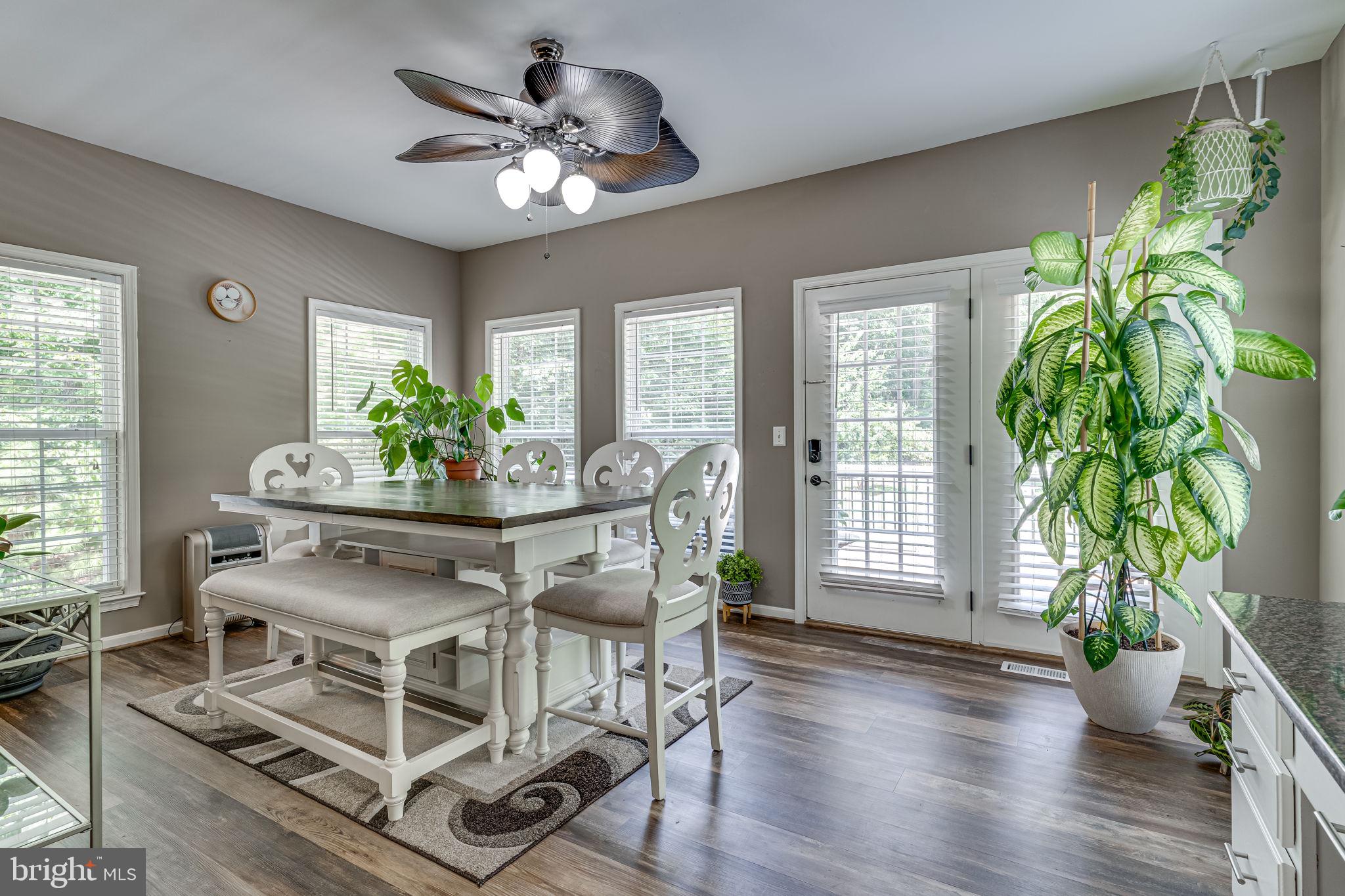6904 North Stuart Road King George, VA 22485 - Photo 8 of 47 a view of a dining room with furniture window and wooden floor
