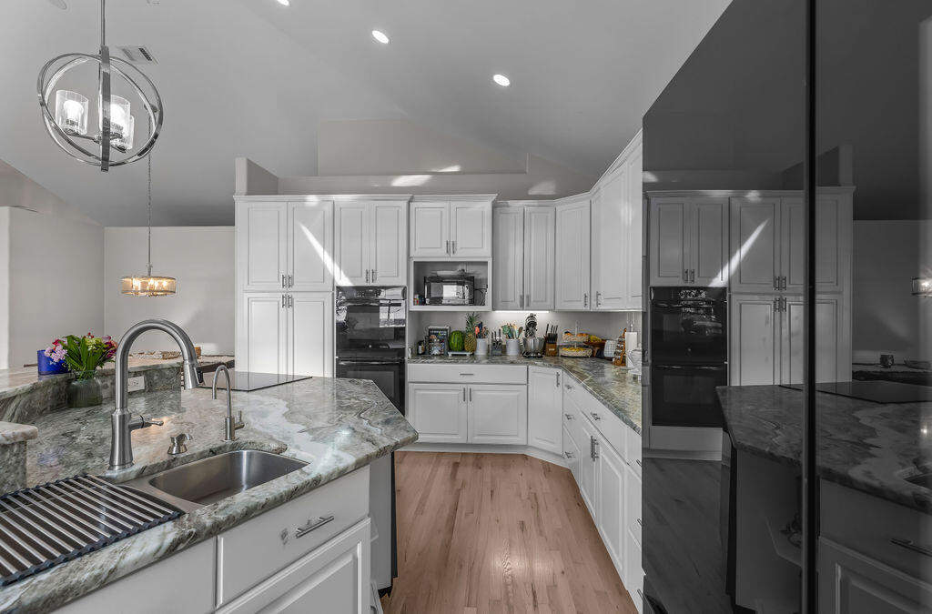 7819 Highway 20 Freeport, FL 32439 - Photo 18 of 75 a kitchen with granite countertop a sink stainless steel appliances and cabinets