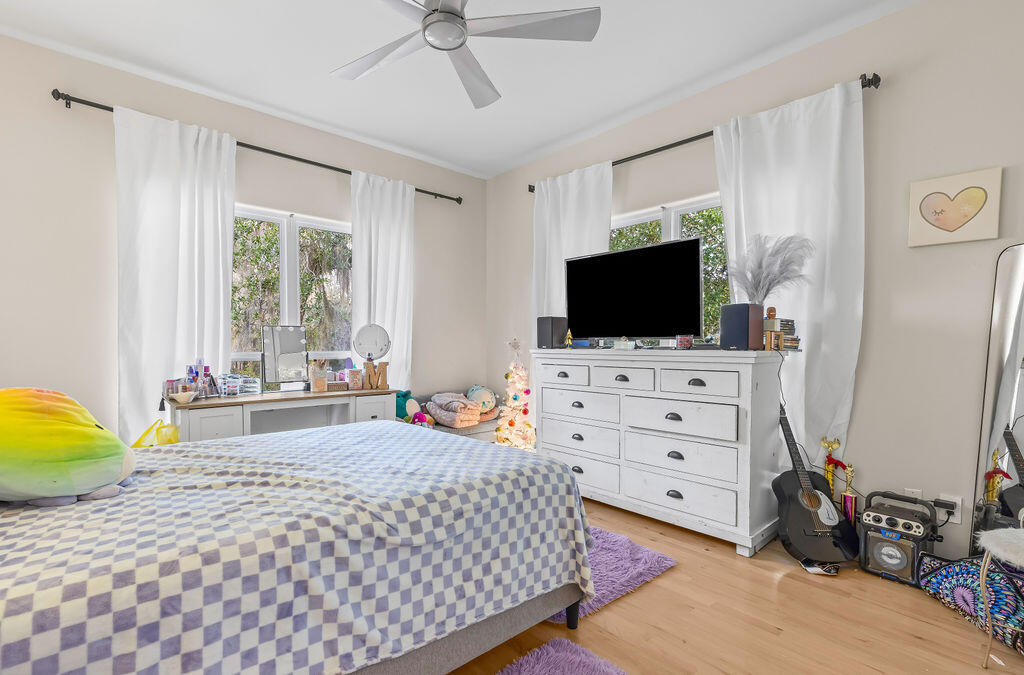 7819 Highway 20 Freeport, FL 32439 - Photo 32 of 75 a bedroom with a bed flat screen tv and a window