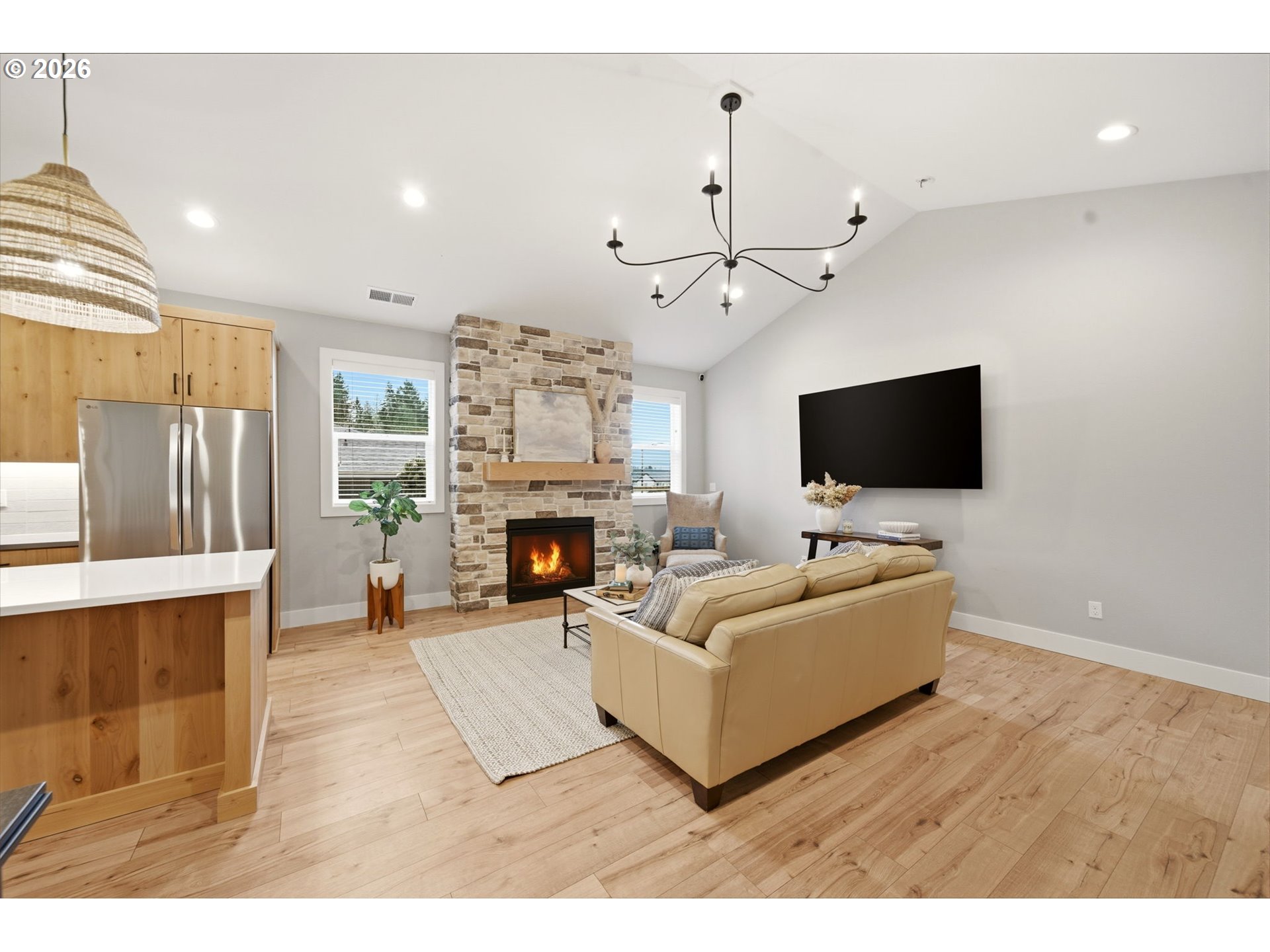 37354 American Street Sandy, OR 97055 - Photo 11 of 37 a living room with furniture a flat screen tv and a fireplace