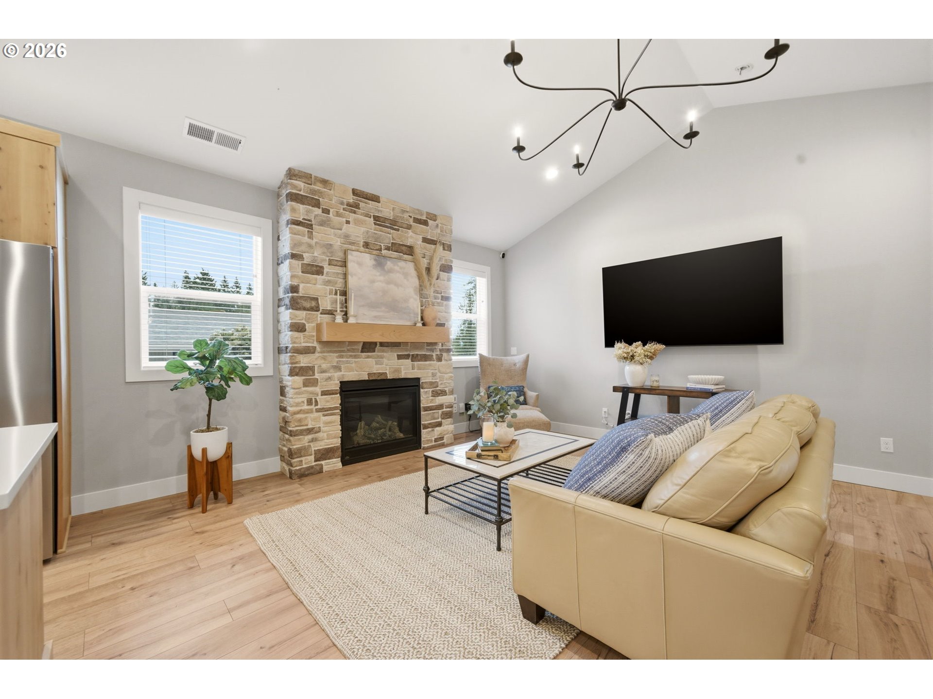37354 American Street Sandy, OR 97055 - Photo 13 of 37 a living room with furniture a fireplace and a flat screen tv