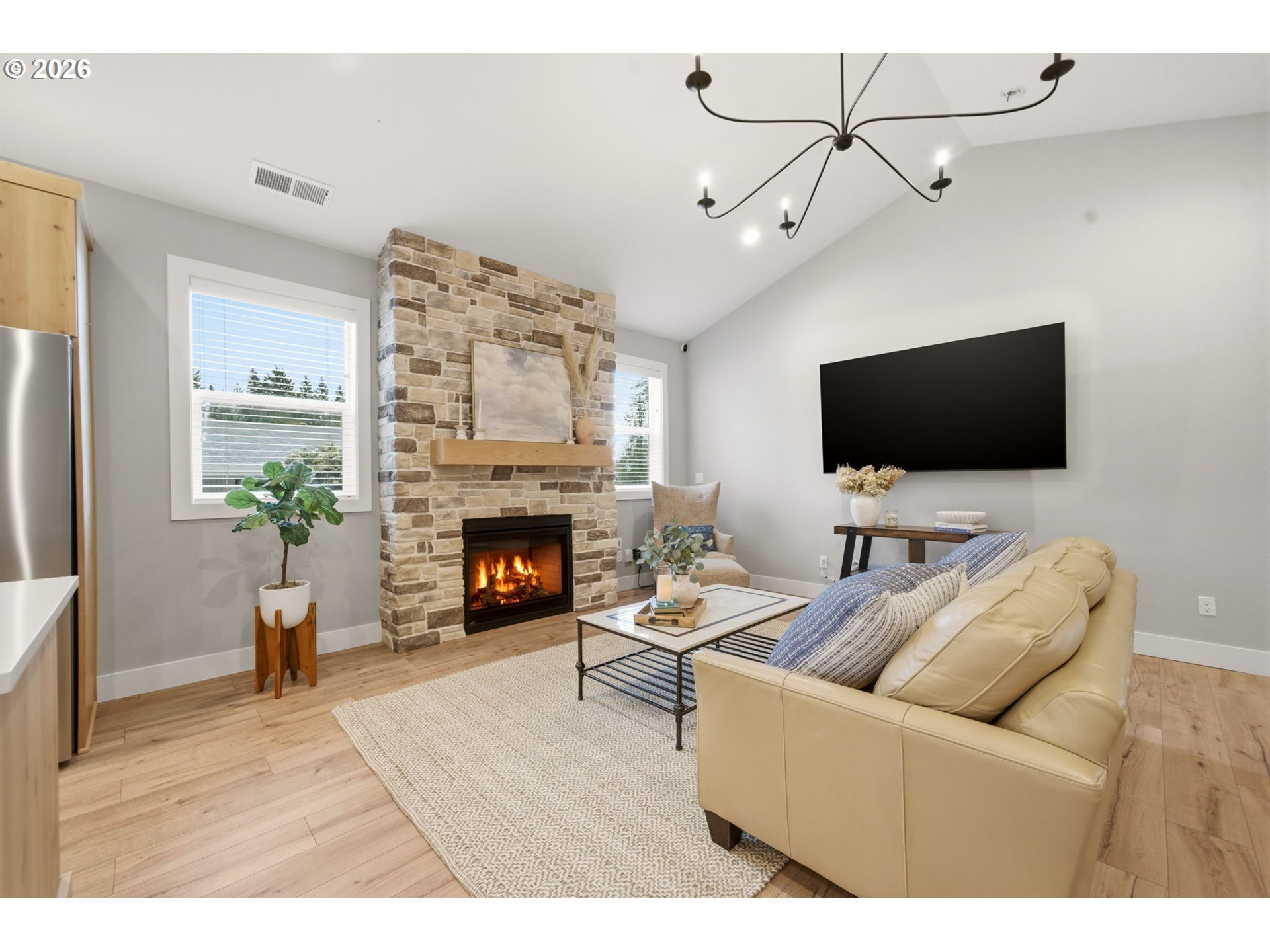 37354 American Street Sandy, OR 97055 - Photo 14 of 37 a living room with furniture a fireplace and a flat screen tv