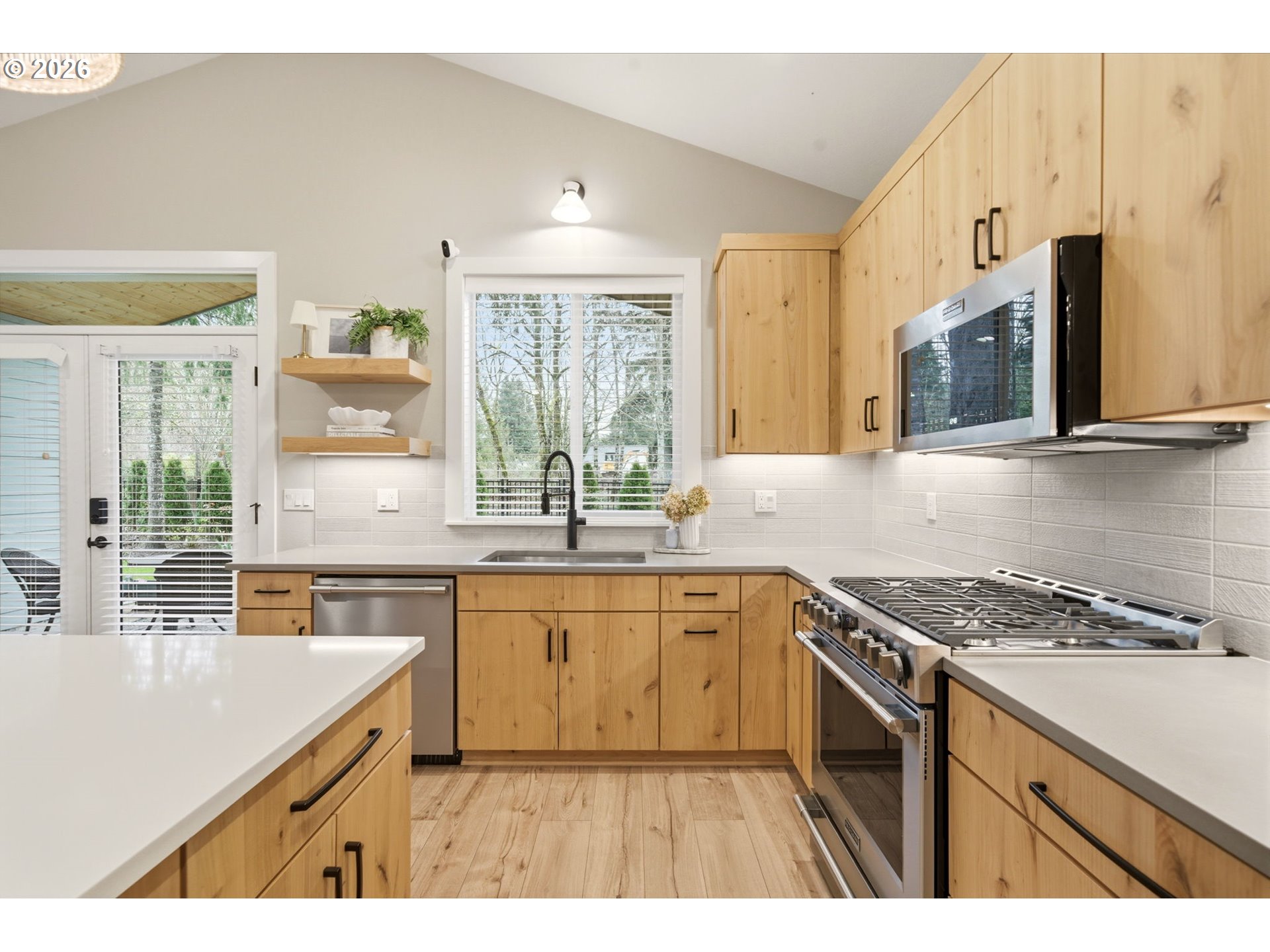 37354 American Street Sandy, OR 97055 - Photo 15 of 37 a kitchen with stainless steel appliances granite countertop a sink stove and cabinets