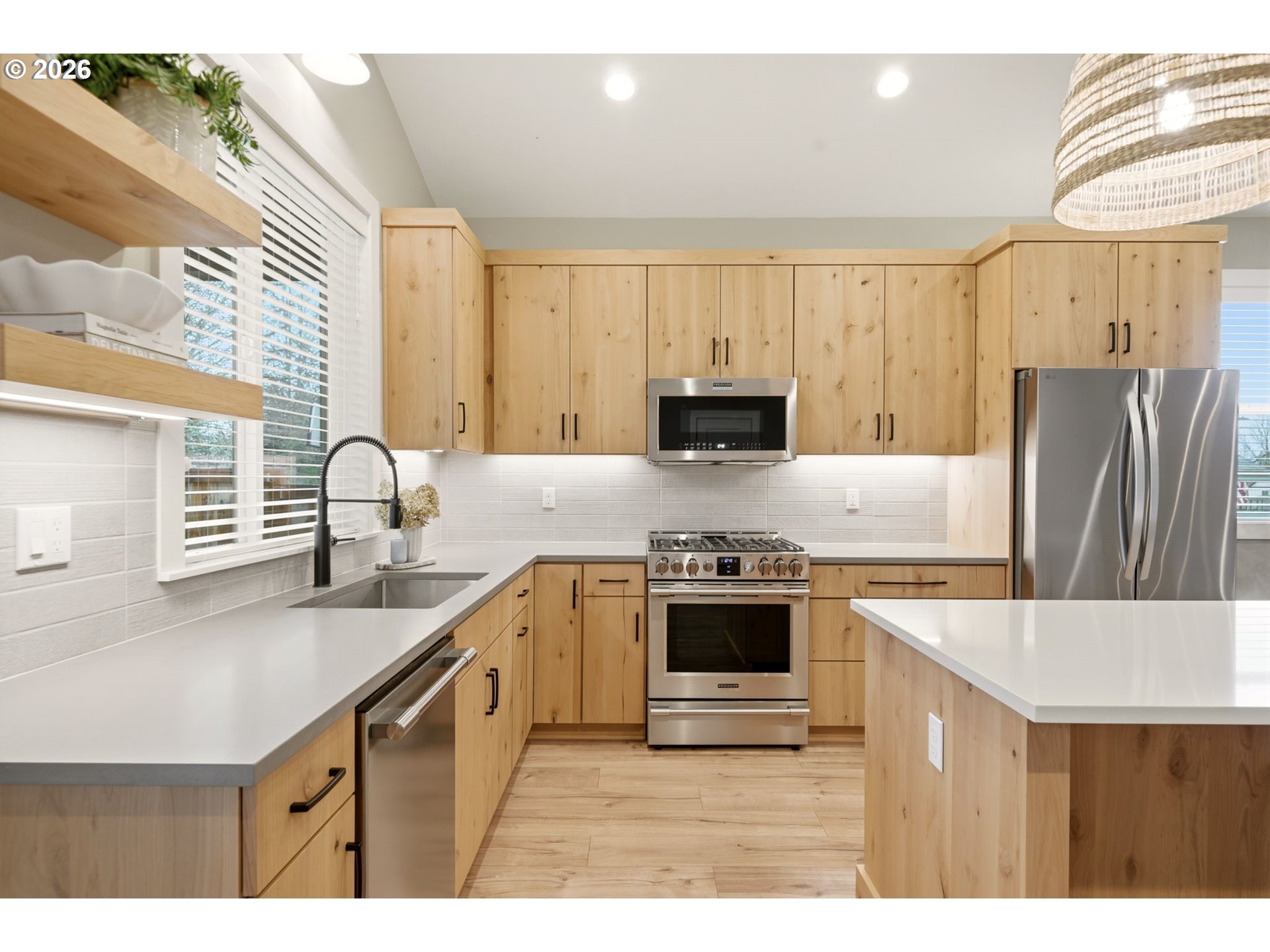 37354 American Street Sandy, OR 97055 - Photo 16 of 37 a kitchen with stainless steel appliances granite countertop a sink stove refrigerator and cabinets