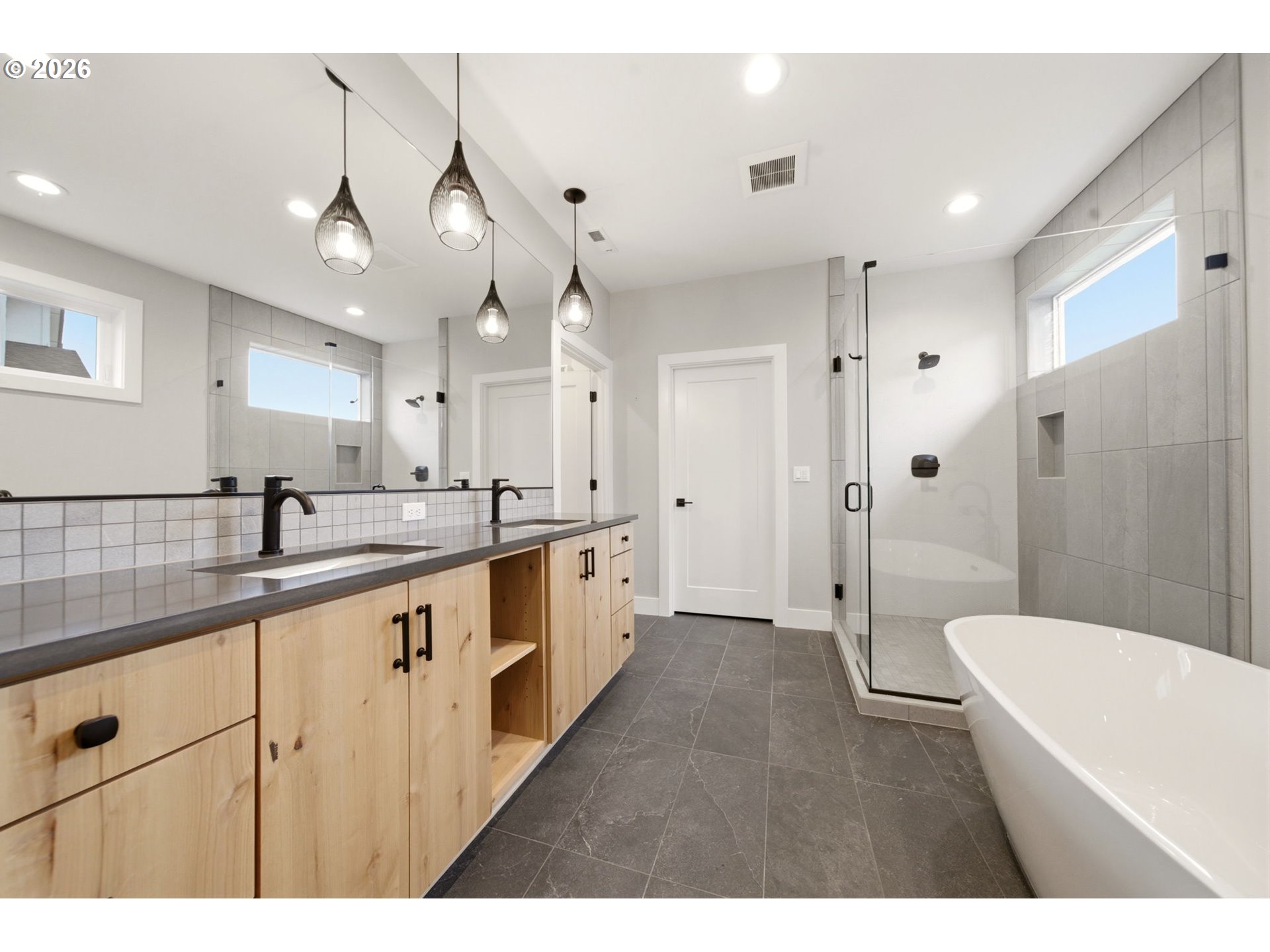 37354 American Street Sandy, OR 97055 - Photo 27 of 37 a bathroom with a sink a toilet a mirror and shower