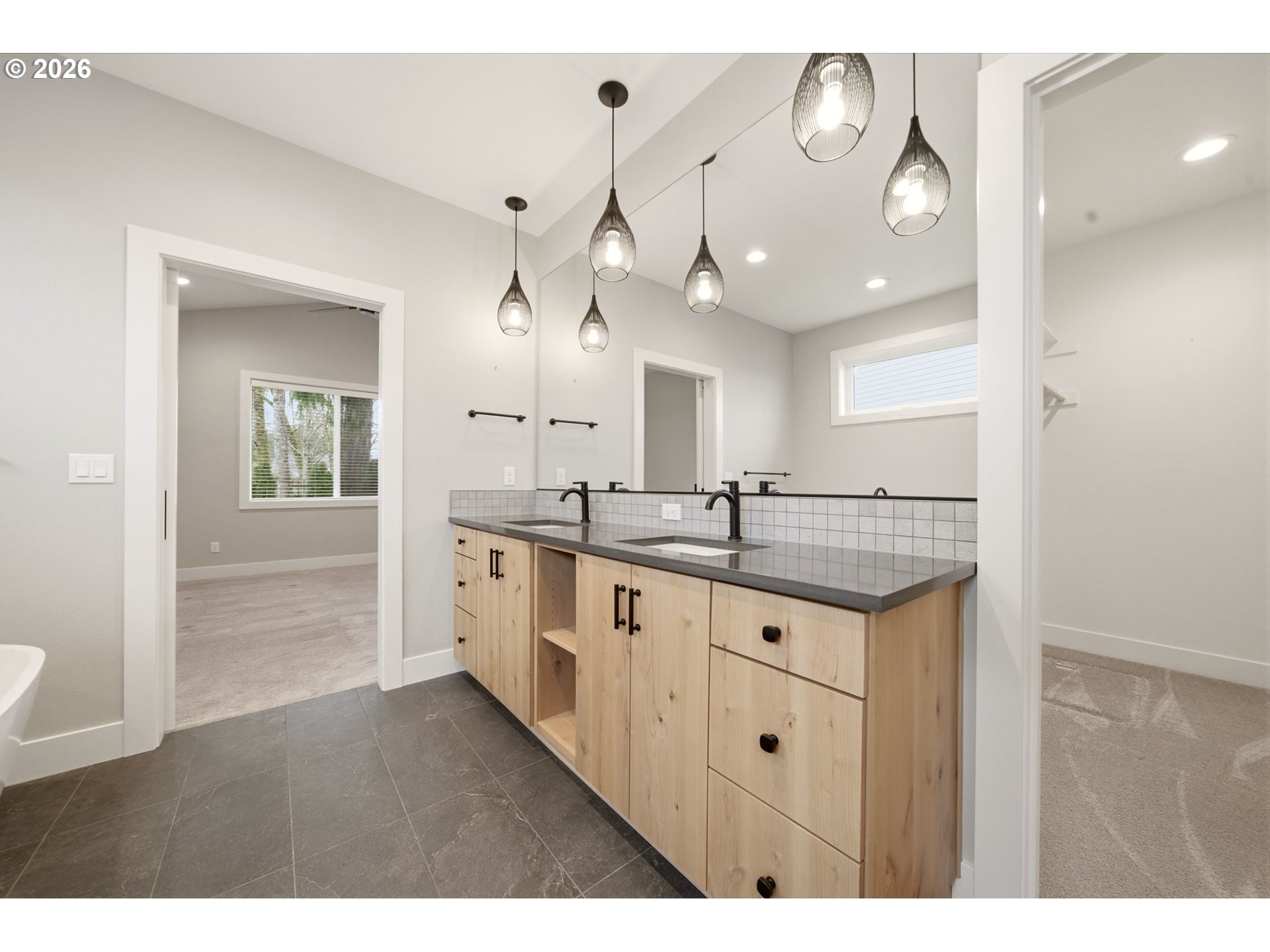 37354 American Street Sandy, OR 97055 - Photo 29 of 37 a bathroom with a granite countertop sink a large mirror and a