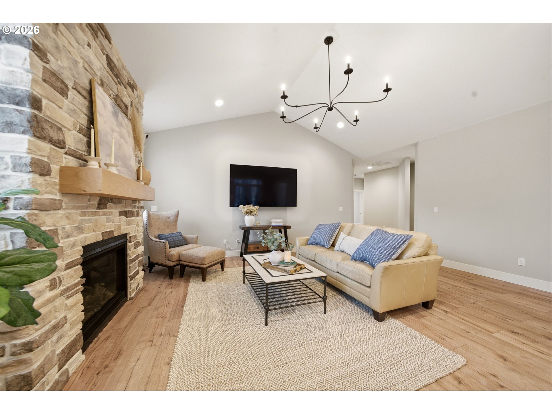 37354 American Street Sandy, OR 97055 - Photo 7 of 37 a living room with furniture a fireplace and a flat screen tv