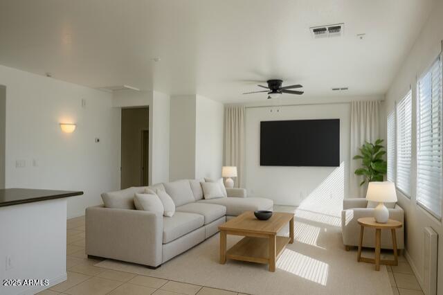2319 West Alta Vista Road Phoenix, AZ 85041 - Photo 16 of 43 a living room with furniture a fireplace and a flat screen tv