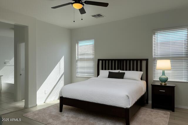 2319 West Alta Vista Road Phoenix, AZ 85041 - Photo 19 of 43 a bedroom with a bed and window