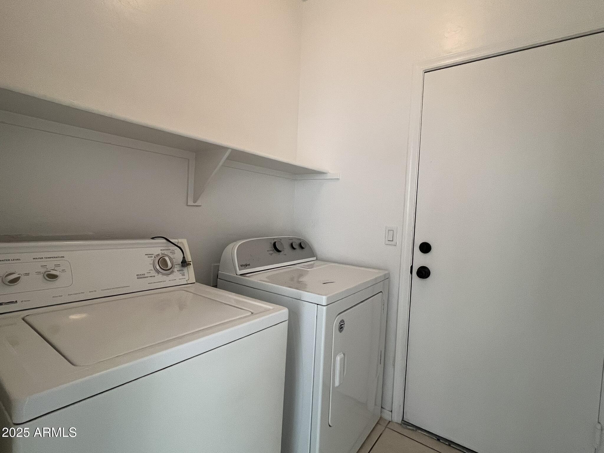 2319 West Alta Vista Road Phoenix, AZ 85041 - Photo 31 of 43 a utility room with dryer and washer